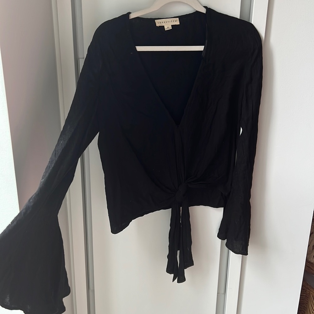 Love stick black Blouse never worn
